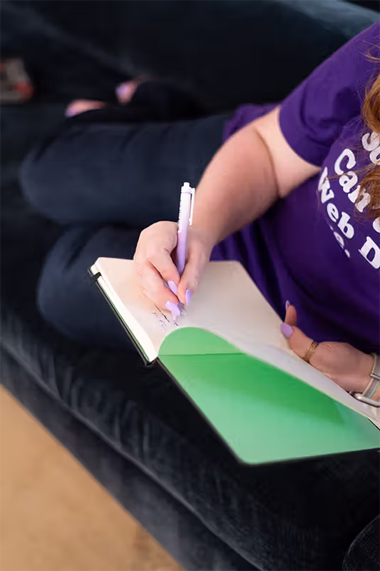 Stacey Writing on Couch